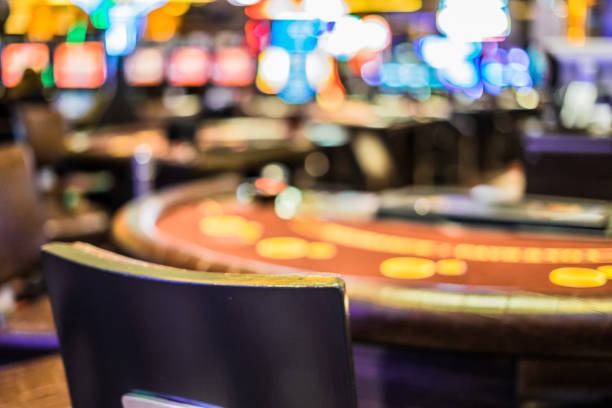 Mobile phone displaying qq4d app with football betting, live-dealer tables, and slot games visible